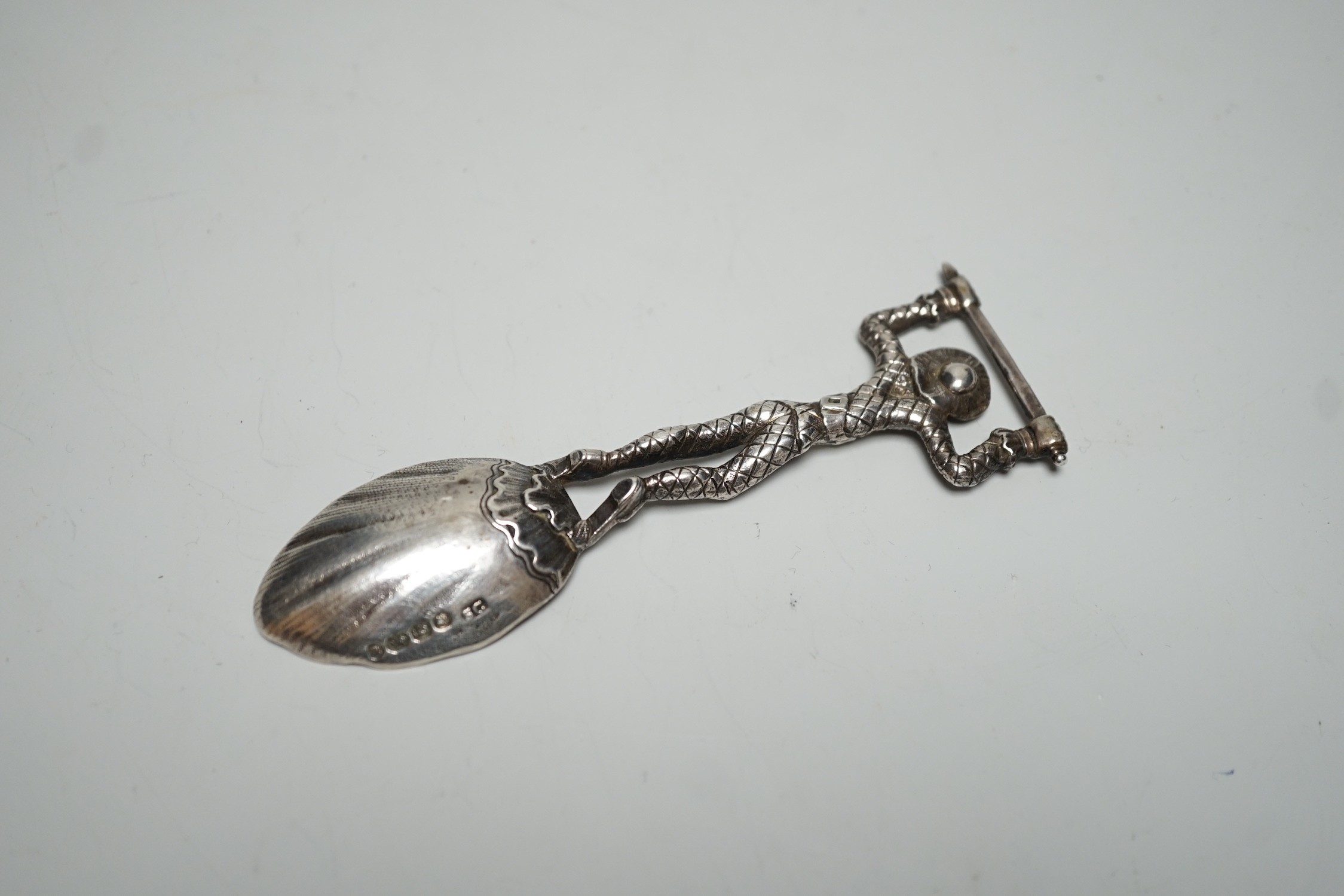An early Victorian novelty silver caddy? spoon, with figural stem, Susanna Cook, London, 1845, 11.6cm.